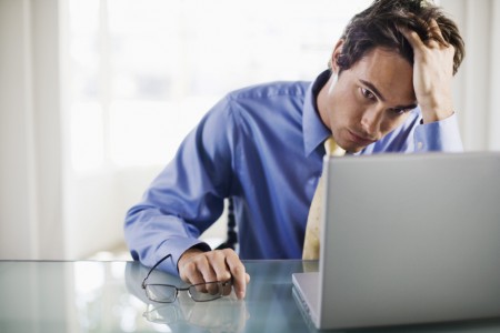 Frustrated-businessman-with-laptop-computer